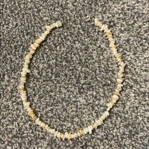 white and cream colored necklace